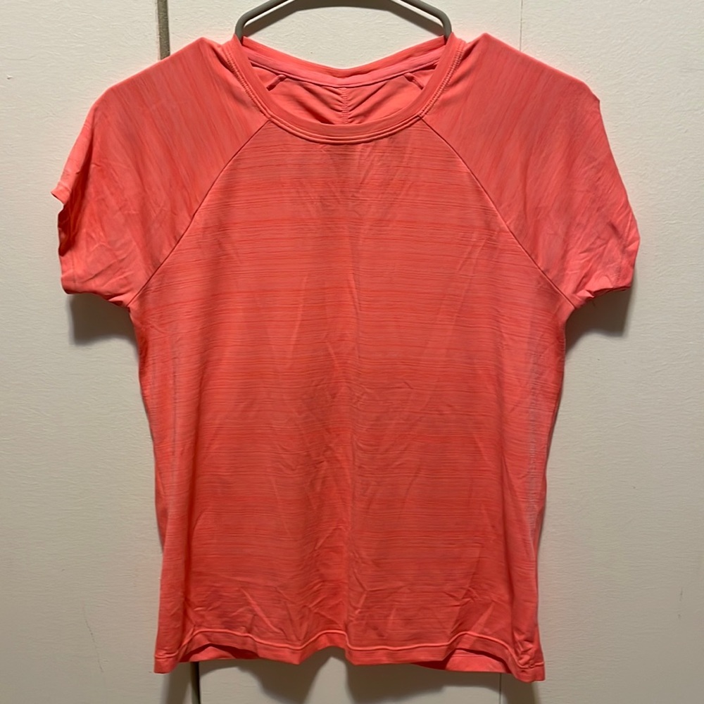 Athleta Girl T Shirt with ruching in the back.  Coral color, size XL (14)